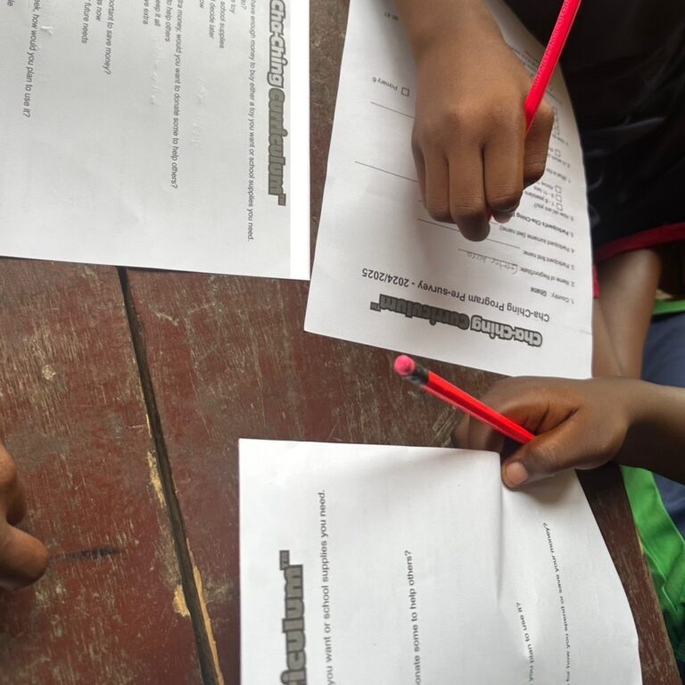 Studentc of CVI using the Cha-Ching materials to determine how financially literate they are