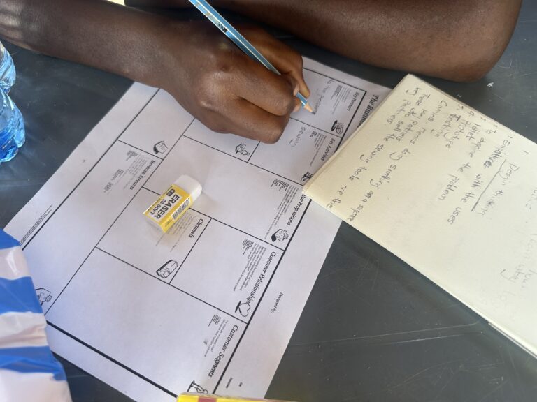 Participant filling worksheet from Akyem Tumfa event
